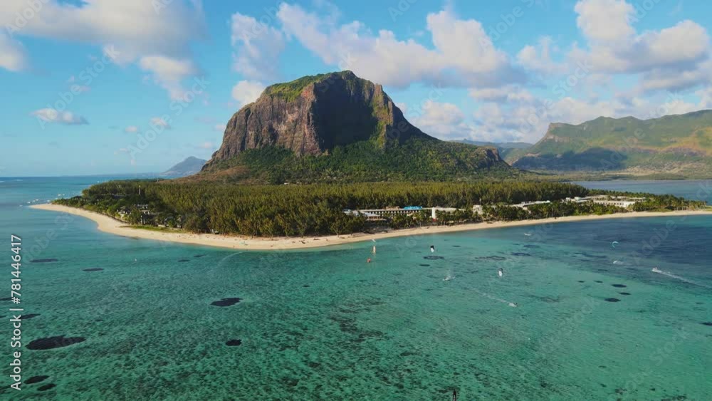 Aerial of Le Morne Brabant Mauritius on a sunny day. Kite surfers and the reef.