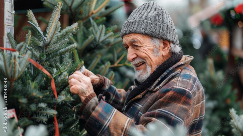 Man in hat and plaid shirt trims Christmas tree