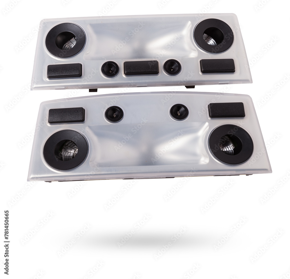 Obraz premium A transparent plastic shade for illuminating the interior on a white isolated background in a photo studio - spare parts for repairing a car interior or for sale in a auto service.
