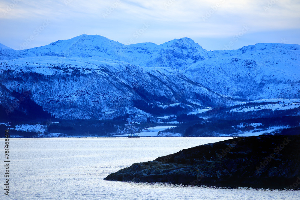 View at the mountains from the Atlantic Ocean Road in winter ( Norway).