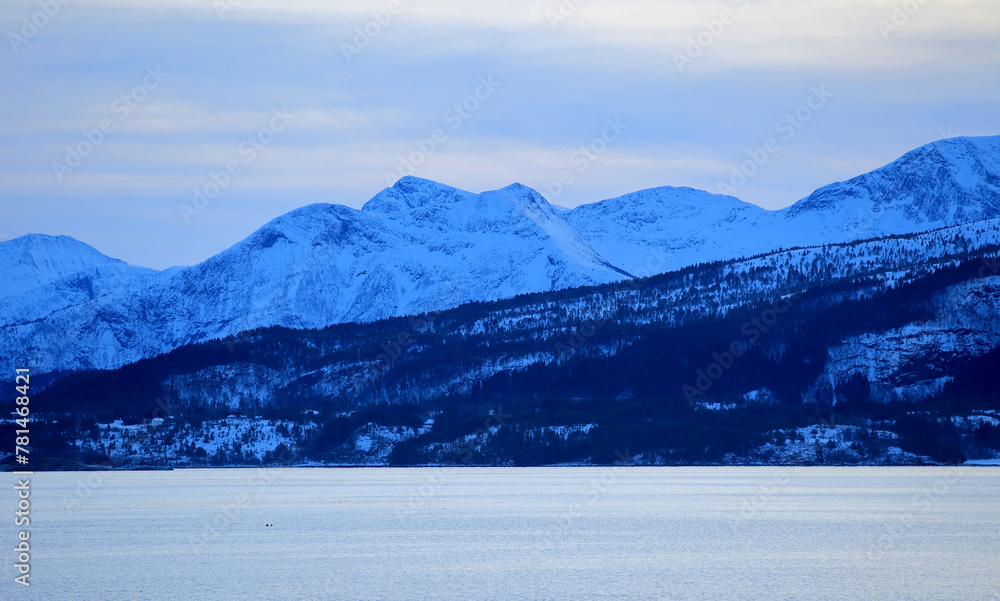 View at the mountains from the Atlantic Ocean Road in winter (Norway).
