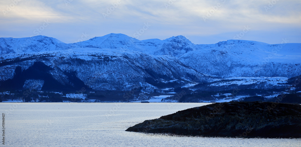 View at the mountains near the Atlantic Ocean Road in winter (Norway).