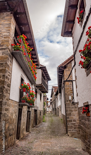 Ochagavía (Otsagabia), Navarra, Spain - October 16, 2023: Narrow street in the historic centre photo