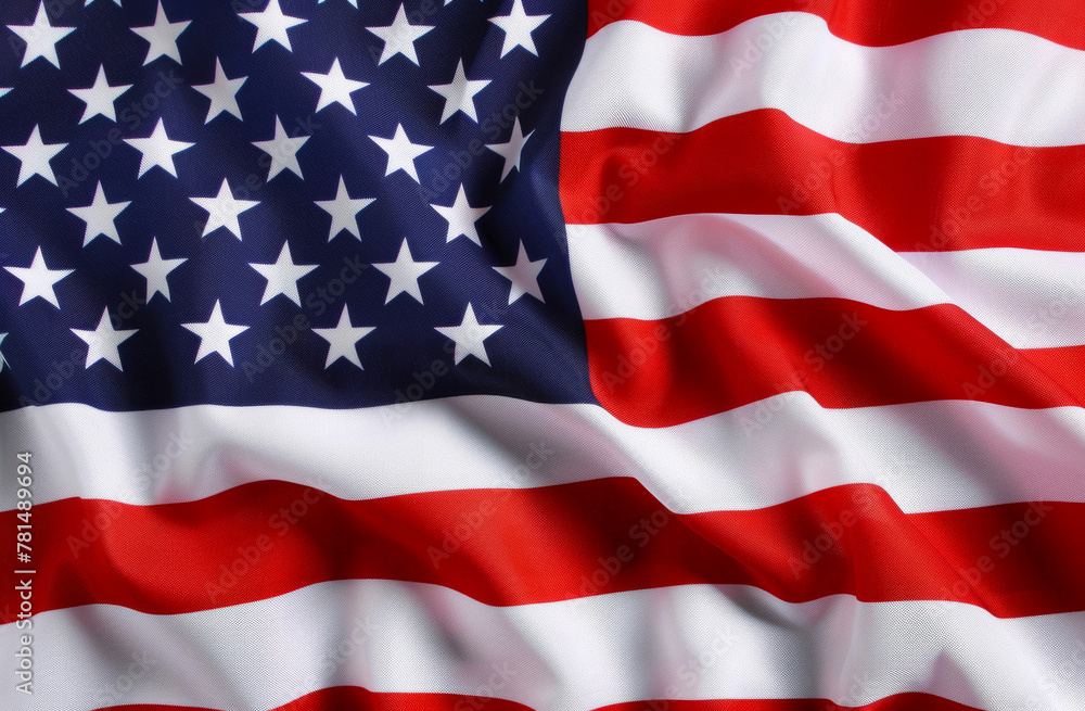 Obraz premium American Flag Waves Elegantly, Stars and Stripes Symbolizing Patriotism and Freedom