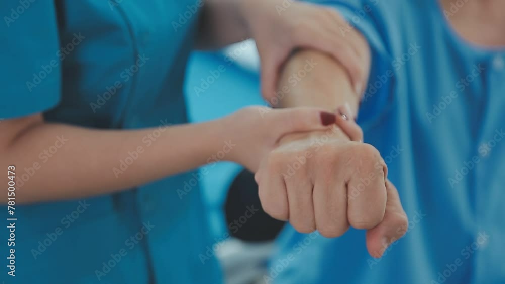 Young attractive female doctor making neck massage to male patient. Young attractive female doctor making neck massage to male patient.