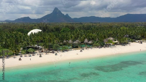 Beautiful Mauritius Island with gorgeous beach Flic en Flac, aerial view from drone. Mauritius, Black River, Flic-en-Flac view of oceanside village beach and luxurious hotel in summer. photo