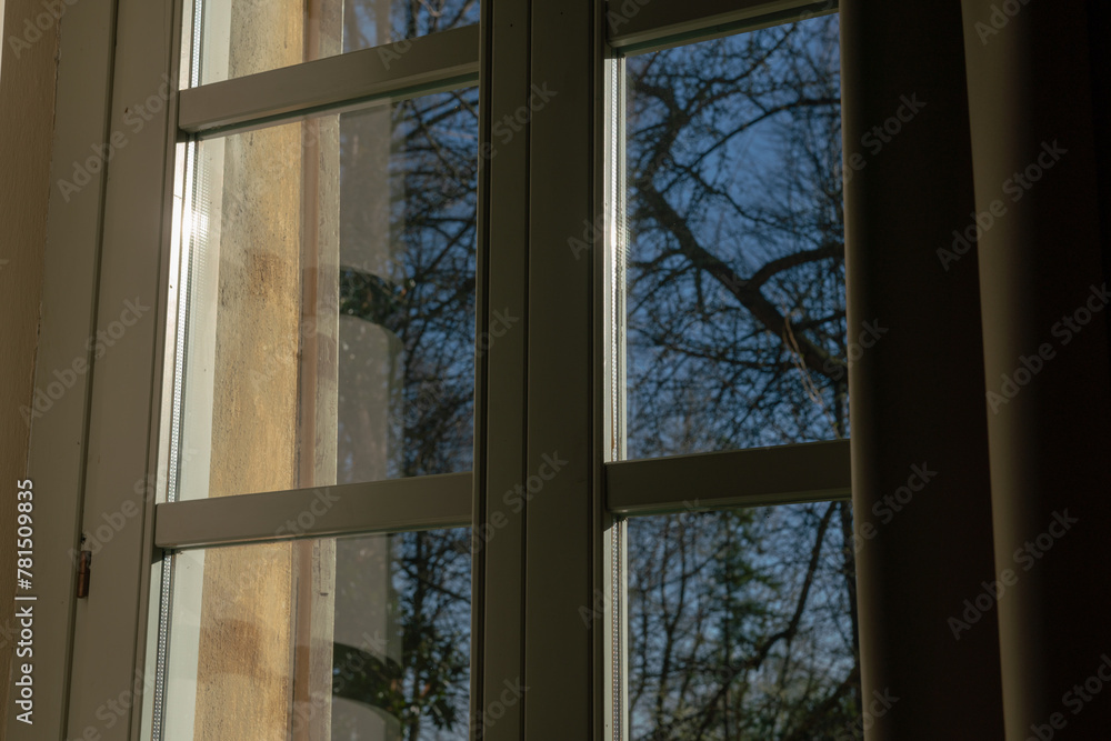 Fototapeta premium double glazed window with light and transparency effects, the solar reflections highlight the structure of the window and its particular important element for a home.