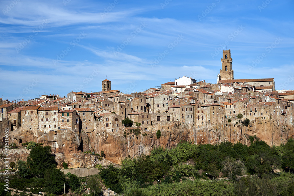view of historic buildings built on tuff rock in the town of Pitigliano