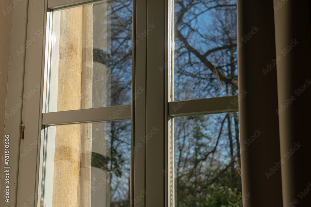 double glazed window with light and transparency effects, the solar reflections highlight the structure of the window and its particular important element for a home. double glazed window with light and transparency effects, the solar reflections highlight the structure of the window and its particular important element for a home.