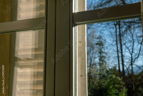 double glazed window with light and transparency effects, the solar reflections highlight the structure of the window and its particular important element for a home.