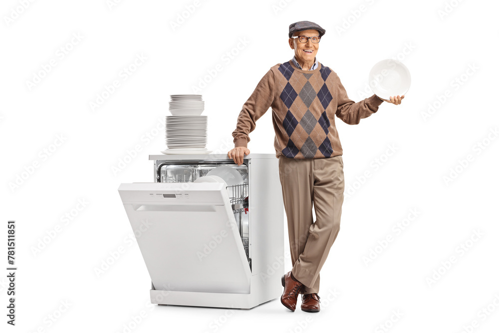 Elderly man with a plate standing next to a dishwasher Elderly man with a plate standing next to a dishwasher
