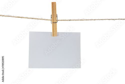 Empty white paper hanging on clothesline with clothespin on transparent background. © JCLobo
