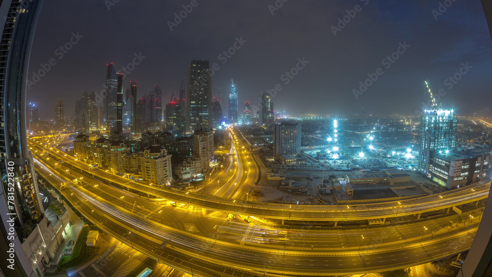 Fototapeta premium Dubai downtown skyline night to day aerial timelapse with traffic on highway