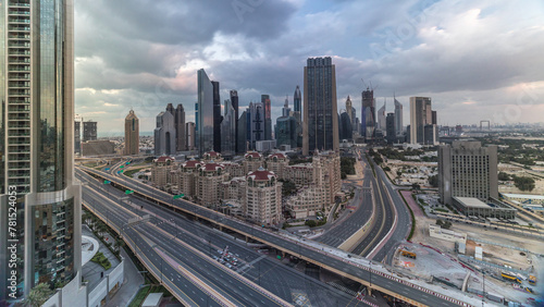 Skyline view of the buildings of Sheikh Zayed Road and DIFC timelapse in Dubai, UAE. © neiezhmakov