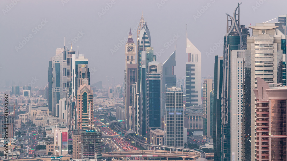 Aerial view to skyscrapers on Dubai downtown and Sheikh Zayed road day to night timelapse, Dubai, United Arab Emirates