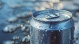 Soda can on sandy beach with water drops