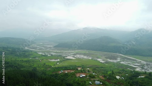 Rice field aerial shot at north east of India. 4k aerial views of beautiful mountain small house and rice terraces field at kangpokpi village rice terraces with senapati river near mayangkhang baptist photo