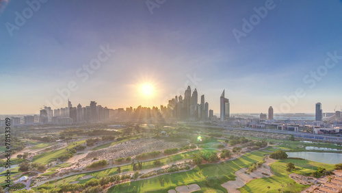 Fototapeta Naklejka Na Ścianę i Meble -  Dubai Marina skyscrapers and golf course sunset timelapse, Dubai, United Arab Emirates