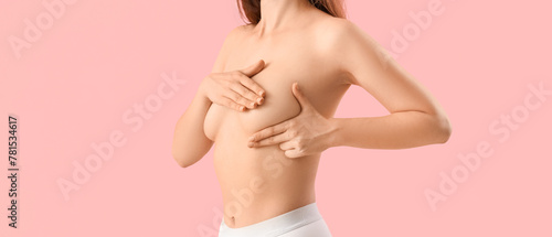 Young woman touching her br...