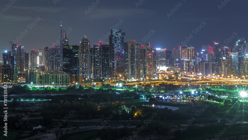 Jumeirah lake towers and Dubai marina skyscrapers and golf course during all night timelapse, Dubai, United Arab Emirates Jumeirah lake towers and Dubai marina skyscrapers and golf course during all night timelapse, Dubai, United Arab Emirates