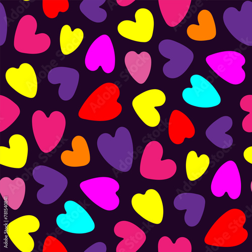Small bright colorful multi-colored hearts isolated on a dark purple background. Cute seamless pattern. Vector simple flat graphic illustration. Texture.