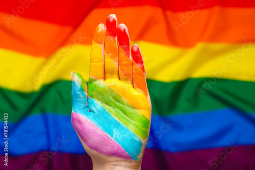 Painted woman s palm against LGBT flag