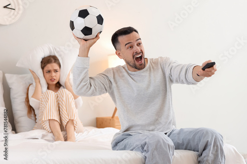 Young man watching football...