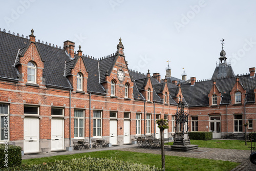 Retirement home in historic begijnhof area of Lier Belgium. Pretty red brick buildings with neat organized architecture houses for elderly © drew