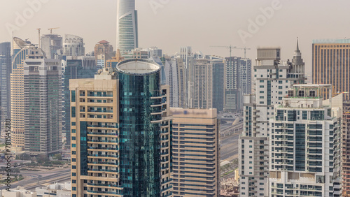 Aerial top view of Dubai Marina morning timelapse. Modern towers and traffic on the road photo