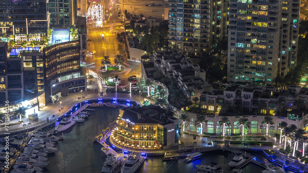 Aerial view on yachts floating in Dubai marina night timelapse. White boats are in canal water. Aerial view on yachts floating in Dubai marina night timelapse. White boats are in canal water.