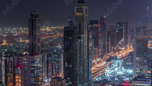 Skyline of the buildings of Sheikh Zayed Road and DIFC aerial night to day timelapse in Dubai, UAE.