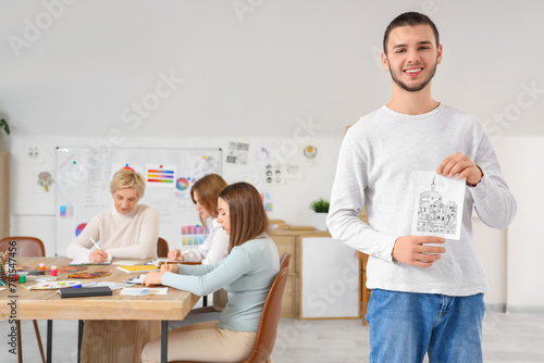 Male student with his drawi...