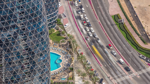 Skyline view of intersection traffic on Al Saada street near DIFC timelapse in Dubai, UAE. photo
