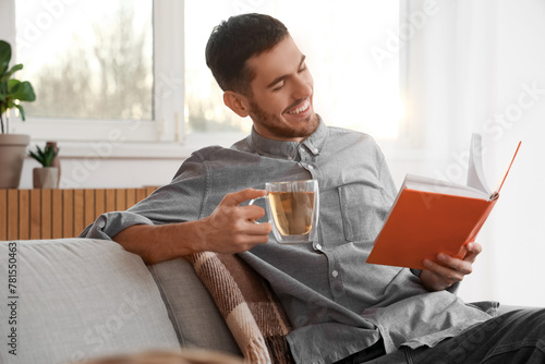 Young man with cup of tea r...