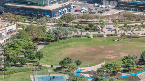 A landscaped public park in Jumeirah Lakes Towers timelapse  a popular residential district in Dubai.