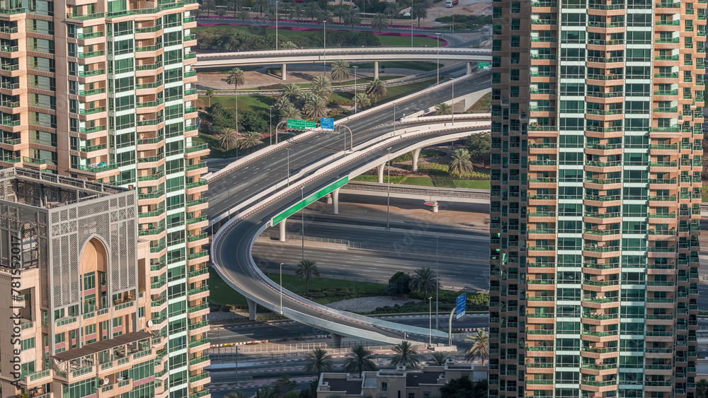 Obraz premium Dubai Marina highway exit between skyscrapers, spaghetti junction aerial view