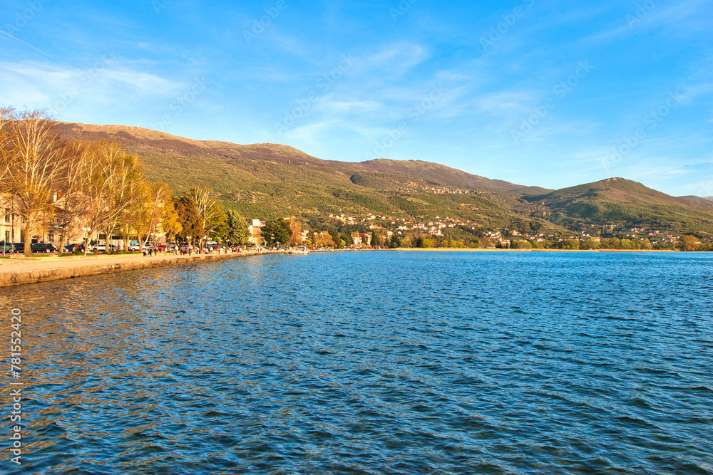 Lake Ohrid, North Macedonia, Spring, Sunset, April 09 2024. Mountain range and peninsula in distance. Ohrid Lake, Macedonia, Europe.The clear mesmerizing waters of lake Ohrid with beautiful view.	