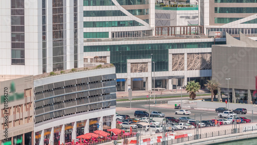 Parking near canal in Dubai at sunny day, UAE aerial timelapse