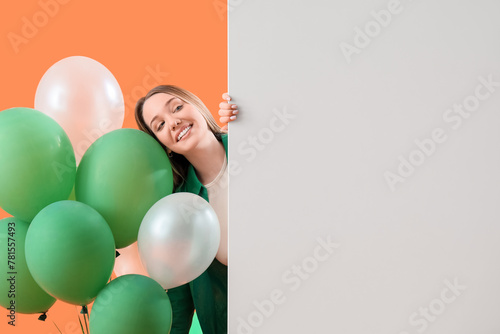 Young woman with balloons a...