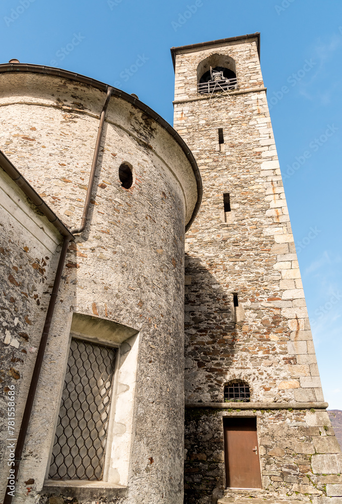 View of the bell tower of Church of Saints Peter and Paul (Santi Pietro e Paolo) in Sant Abbondio location in Gambarogno, district of Locarno, Ticino, Switzerland.