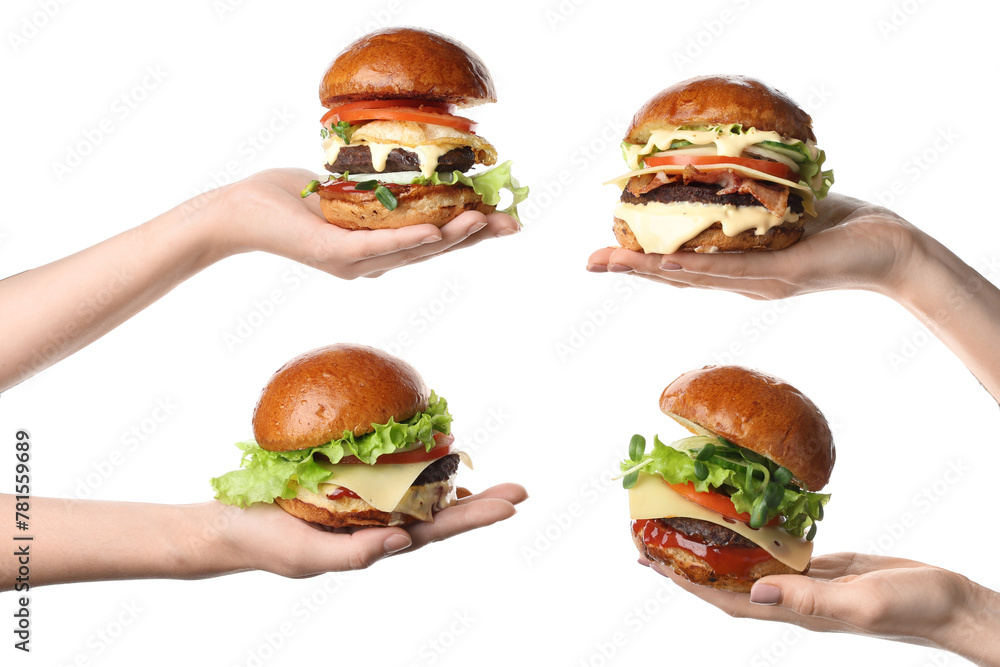Female hands holding tasty burgers on white background Female hands holding tasty burgers on white background