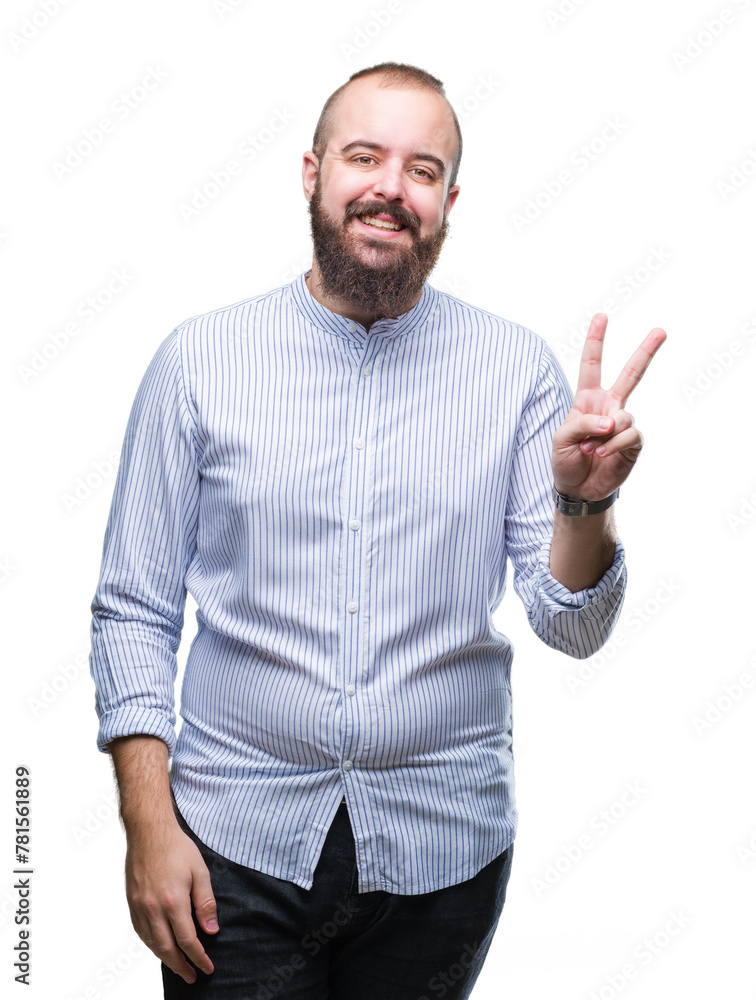 Young caucasian hipster man over isolated background smiling with happy face winking at the camera doing victory sign. Number two. Young caucasian hipster man over isolated background smiling with happy face winking at the camera doing victory sign. Number two.
