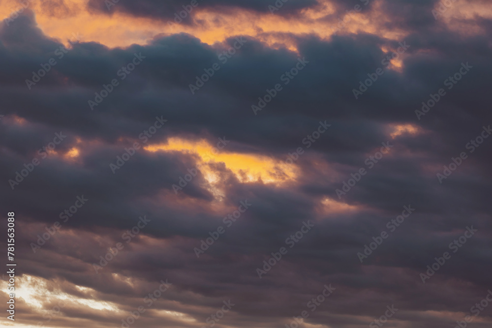 Real majestic sunrise sundown sky background with gentle colorful clouds. Dramatic sunset and sunrise sky. The Cloudy After Rain Sunset. Meteorology. Synoptics. Changes in the weather. Cloud Front.