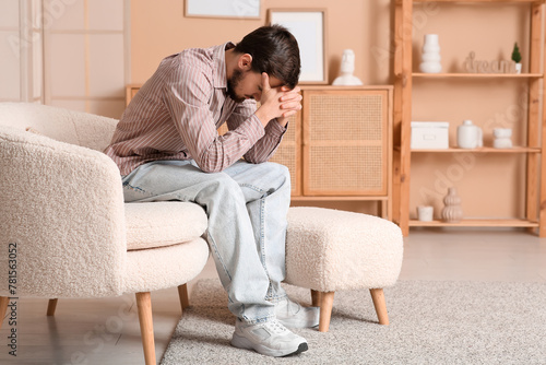 Young man experiencing sadn...