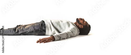 Black African American Man Sleeping concept. Eyes closed. White shirt and jean pants. Bearded man. Laying on the isolated white background. Can also represent Fainted, dead, relaxed, relaxation, drunk