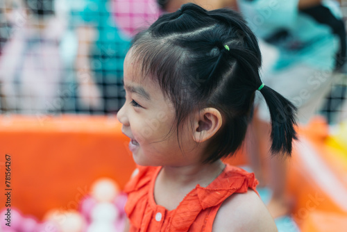 portrait of a 6 years old Chinese girl playing happily