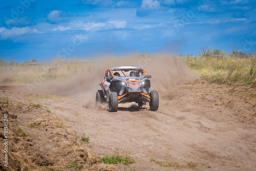 UTV in action offroad vehicle racing on sand dune. Extreme, adrenalin. 4x4.