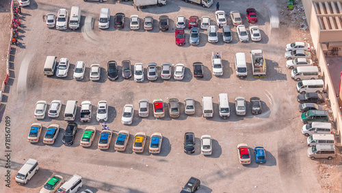 Aerial view full cars at large outdoor parking lots timelapse in Dubai, UAE. photo