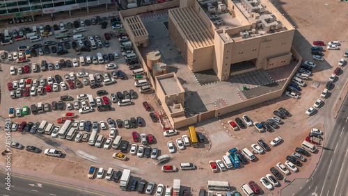 Aerial view full cars at large outdoor parking lots timelapse in Dubai, UAE.