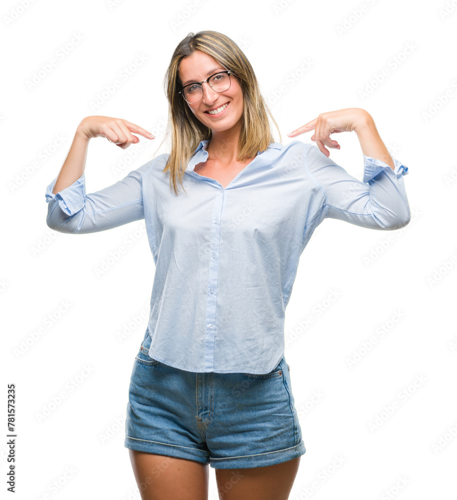 Fototapeta premium Young beautiful business woman over isolated background looking confident with smile on face, pointing oneself with fingers proud and happy.